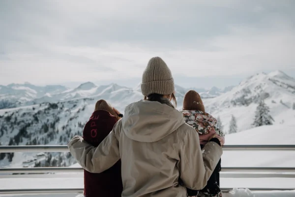 Enjoying the view of a large family in a winter chalet